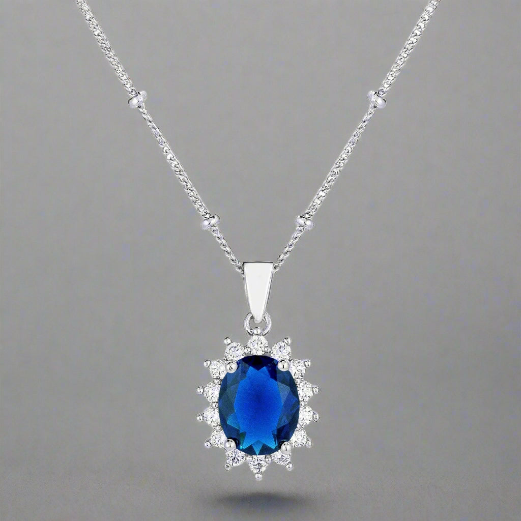 Rhodium Plated Sapphire Blue Petite Royal Oval Pendant